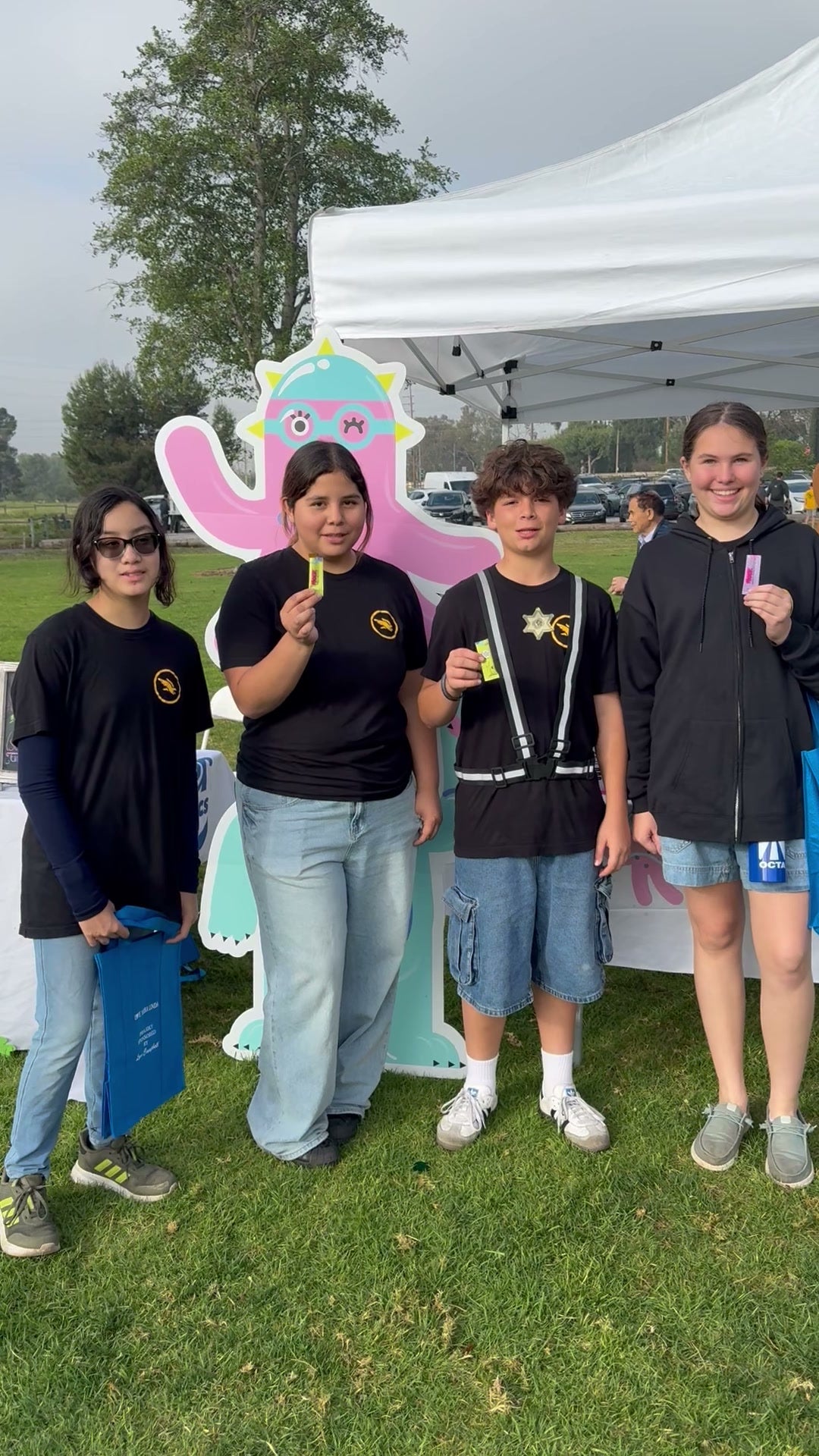 Kids holding MOER at a team event